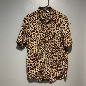 H&M short sleeve leopard print button down shirt.